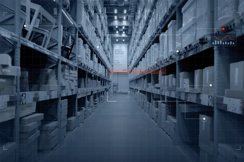 Long aisle of stocked shelves in a spares warehouse